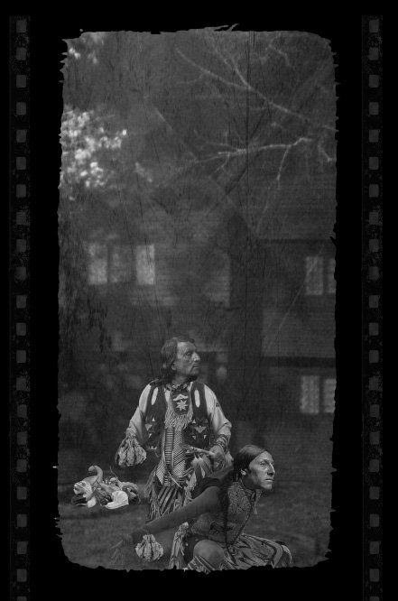 Native Americans tossing pumpkins on Thanksgiving at White folk in front of The Witch House in Salem on Thanksgiving